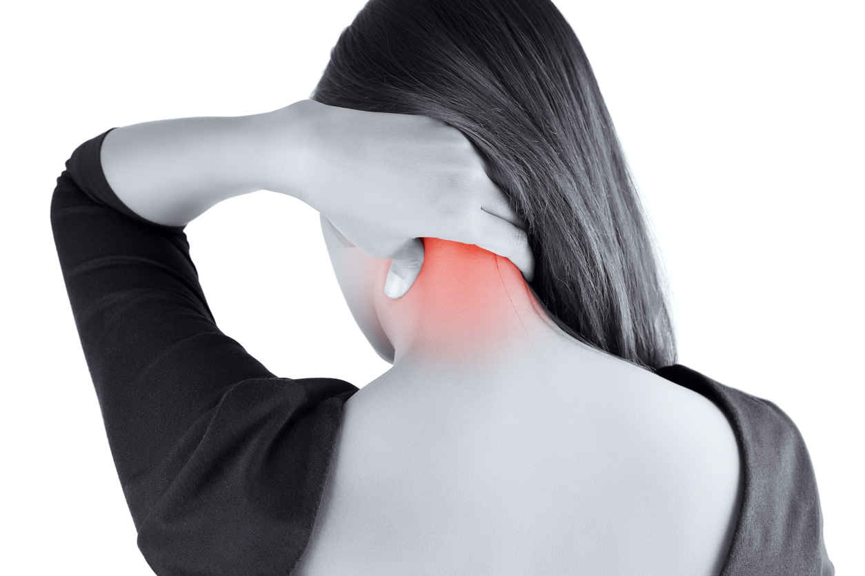 Woman having pain in the neck due to whiplash.